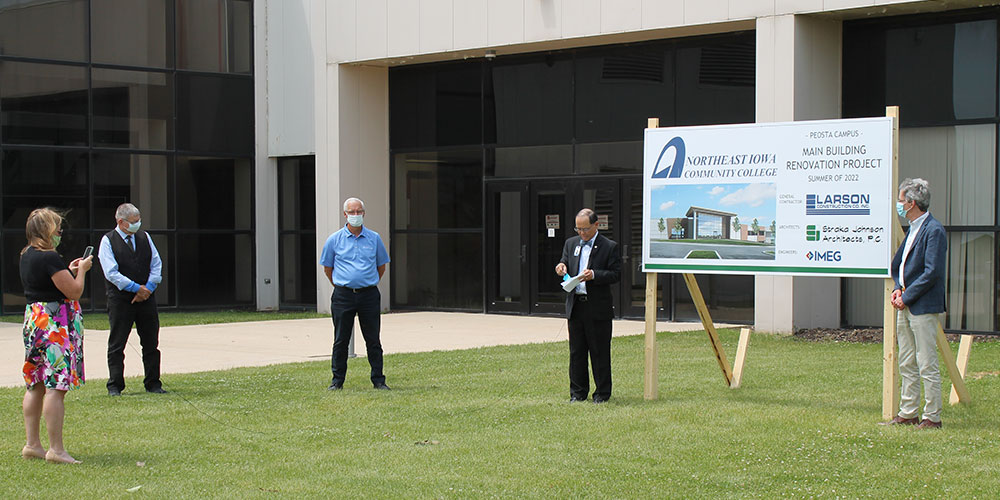 Dr. Wee outside of Peosta campus before groundbreaking