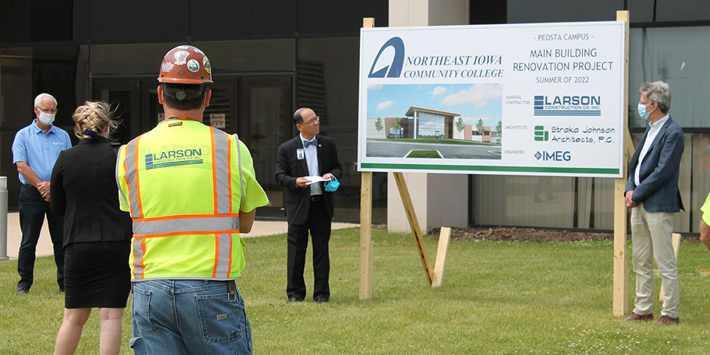 Dr. Wee outside of Peosta campus before groundbreaking