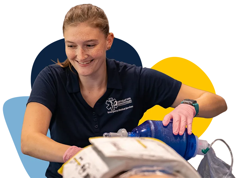 An NICC EMT student working in the ambulance simulation lab.