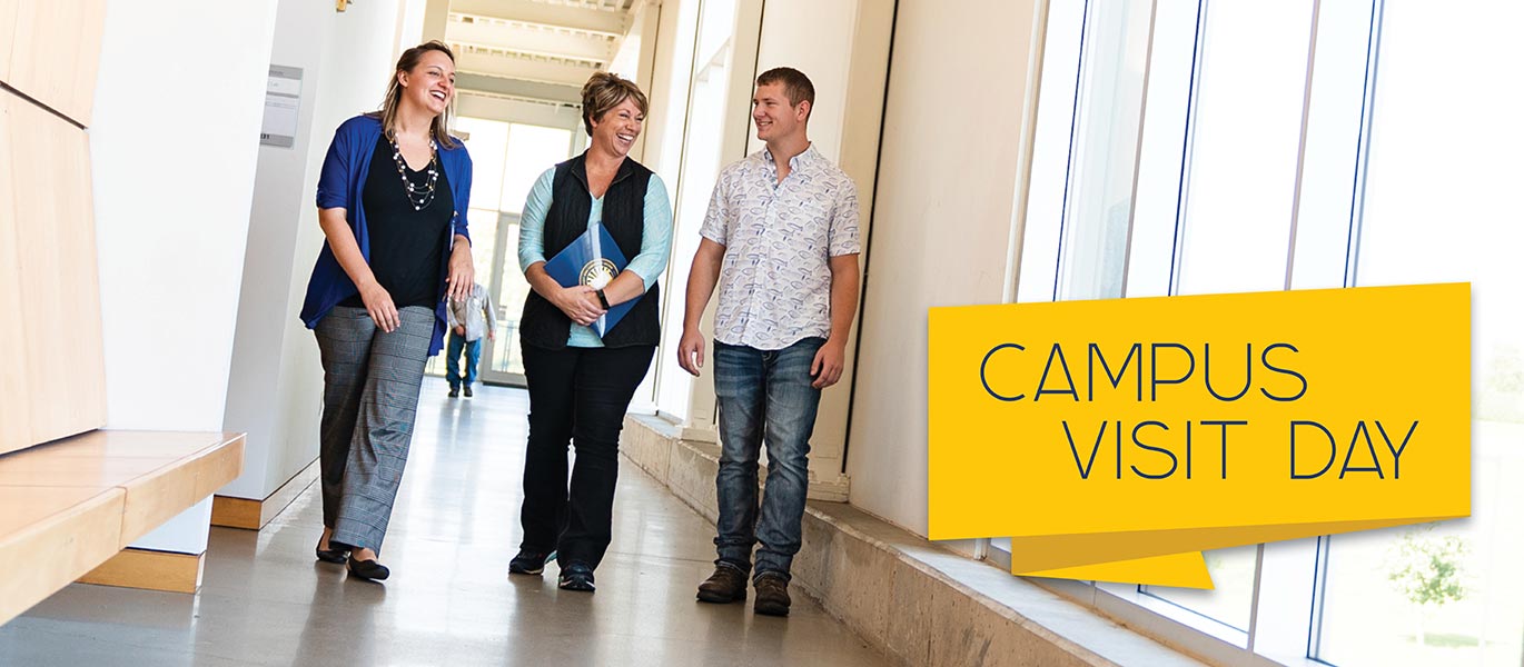 An admissions representative gives a campus tour on the Peosta campus.