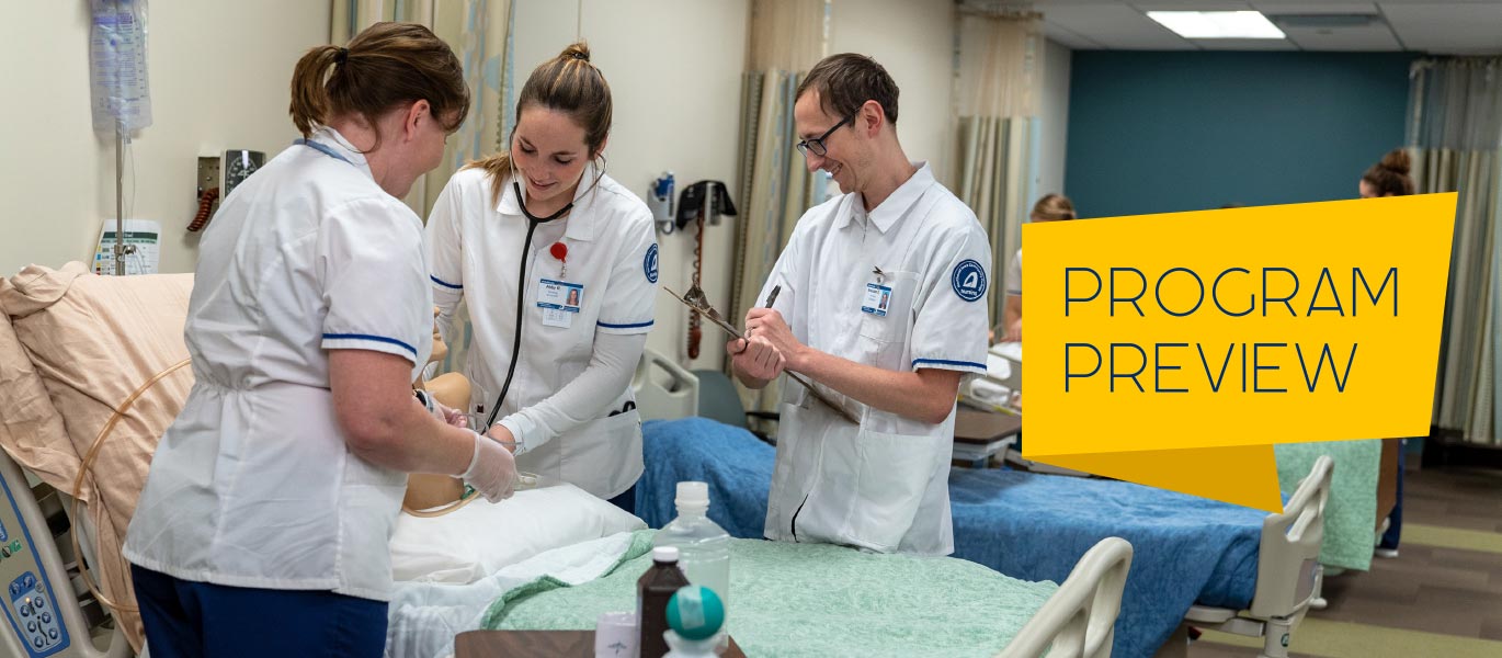 Students practice on mannequins in the nursing lab.