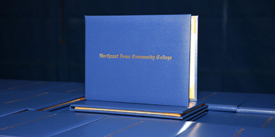 Blue graduation diplomas on a table