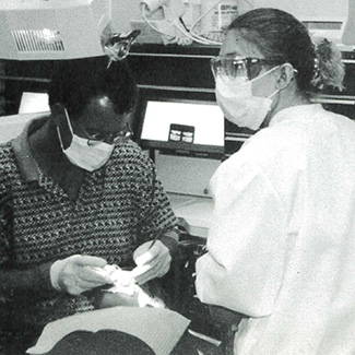 An NICC dental student and instructor working in the dental lab, 1999.