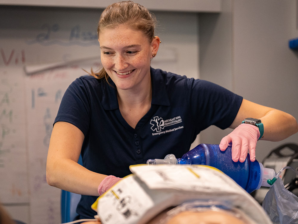 Female EMT working on a dummy