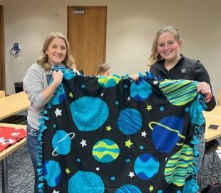 healthcare students making blankets