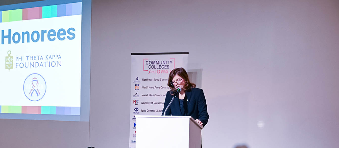 Speaker at podium at All-Iowa Academic Conference