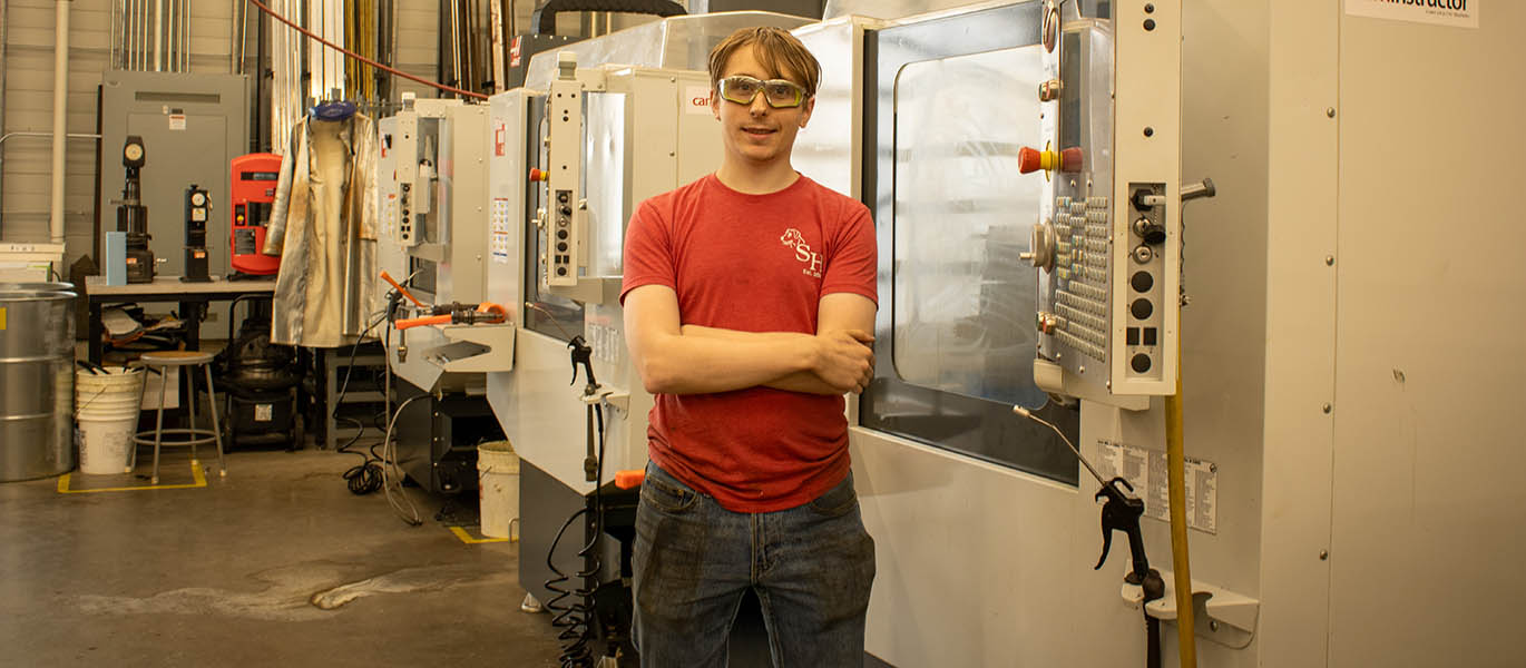 Andrew Kaalberg stands in CNC lab