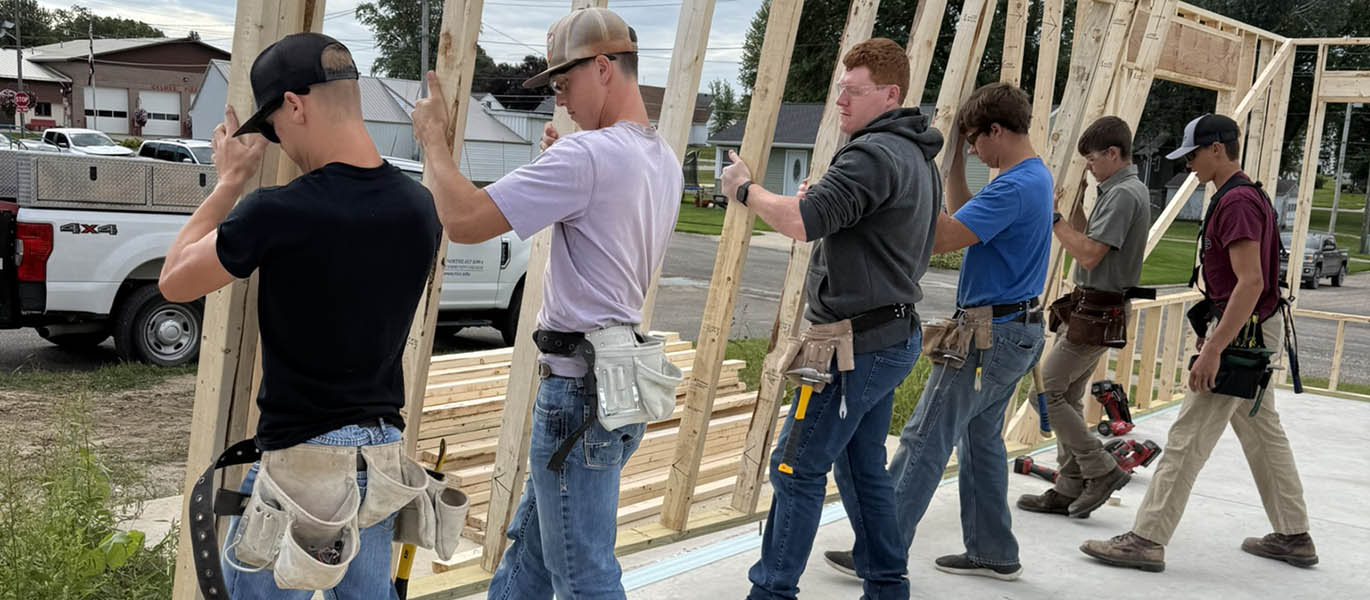 Students frame house