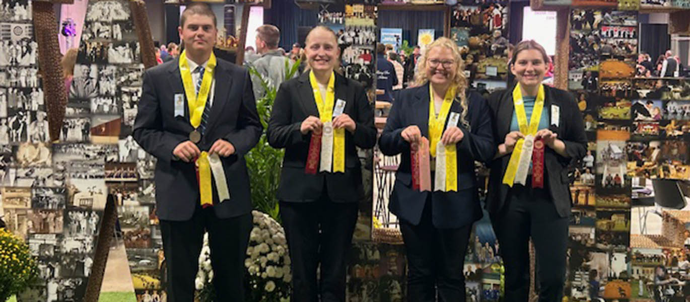 Students hold ribbons at World Dairy Expo