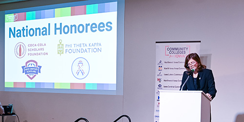 Speaker at podium at All-Iowa Academic Conference