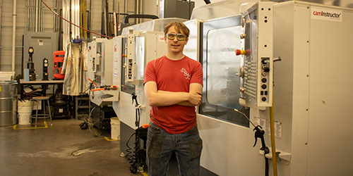 Andrew Kaalberg stands in CNC lab