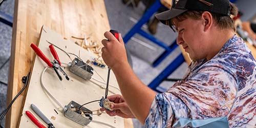 Electrician student at work