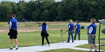 photo of sports shooting team competing.