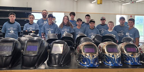 Students pose for photo at 2025 welding camp