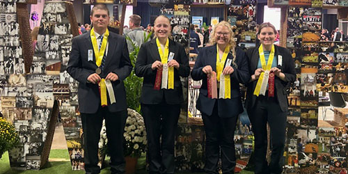 Students hold ribbons at World Dairy Expo