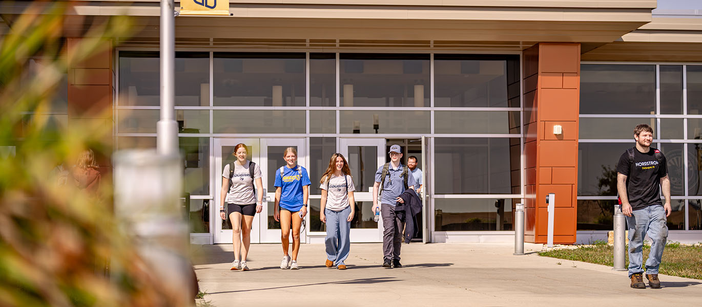 Students walk outside on Peosta campus