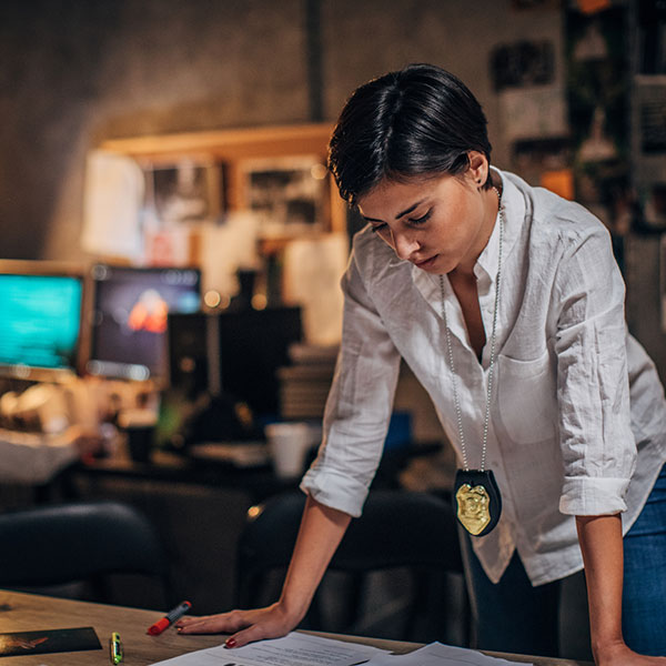 Female detective working in an office