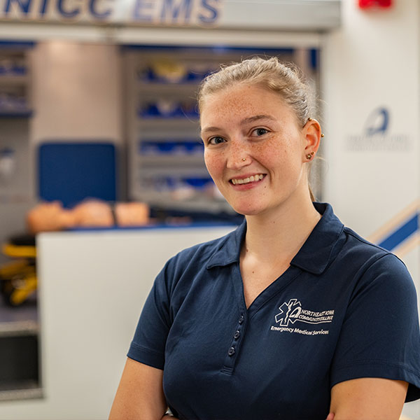 EMT students working on dummy in rig