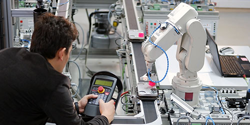 Man working on a robotic machine