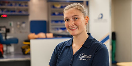 EMT student poses in the lab