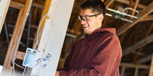 An NICC student works in a construction lab.