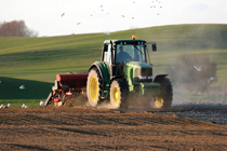 Photo of Tractor in farm field.